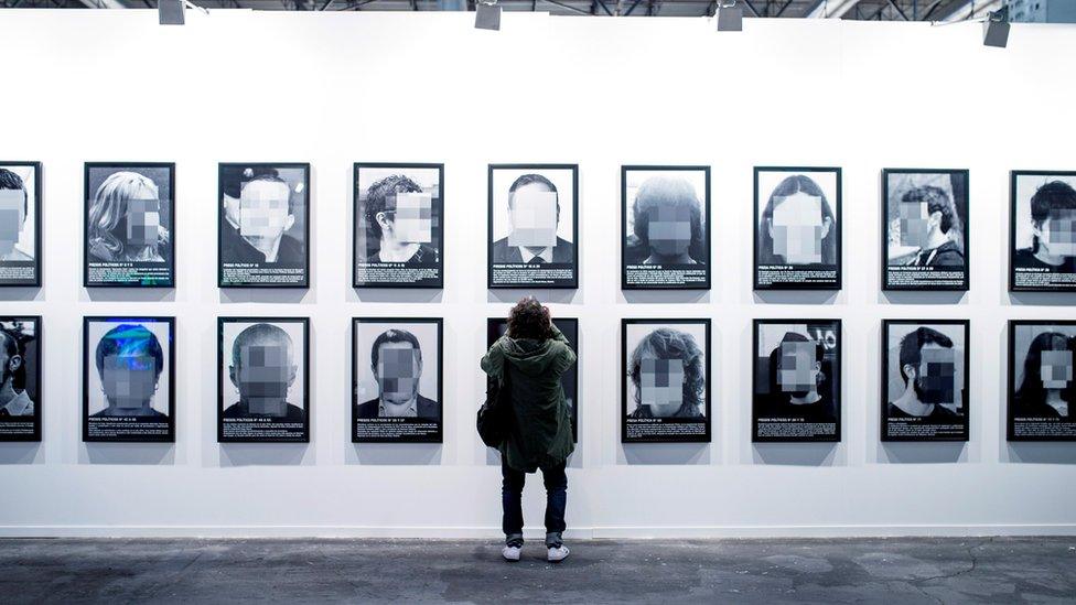 A view of the artwork "Presos politicos" (Political prisoners) by Spanish artist Santiago Sierra of Santiago Sierra