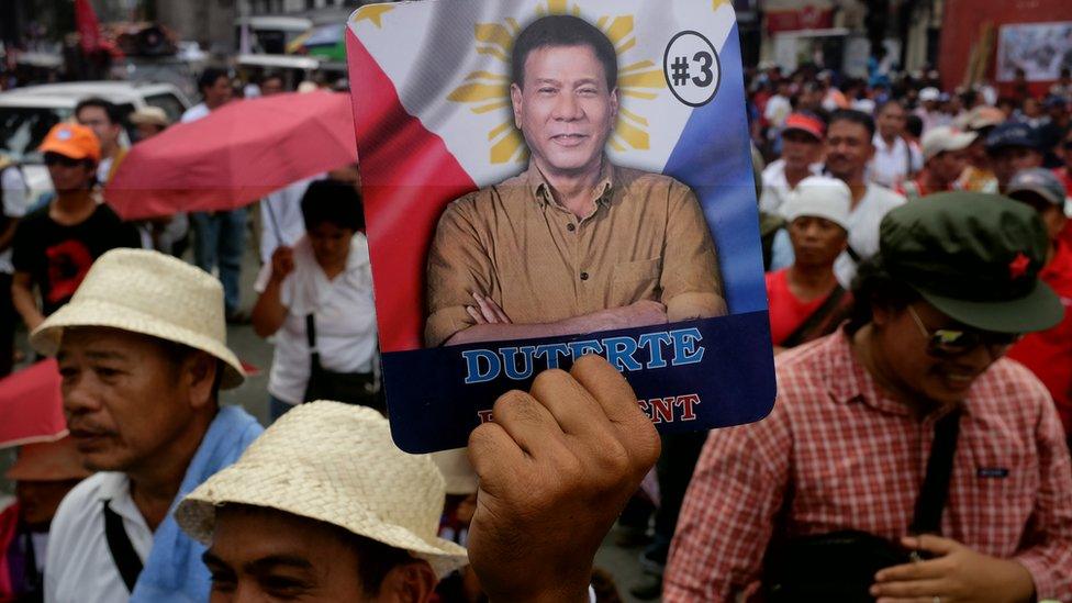 Leftist activists march in Manila to show support for Rodrigo Duterte during his oath to office on June 30, 2016 in Manila, Philippines.