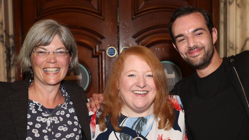 Alliance Party leader Naomi Long with newly-elected Tara Brooks and Micky Murray during the May 2023 Northern Ireland council election