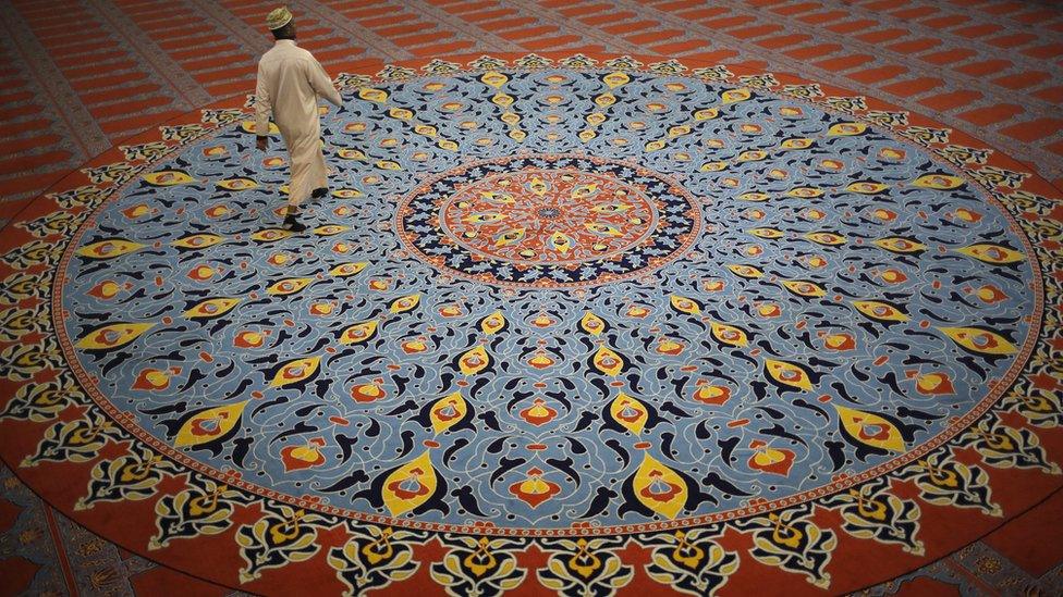 A muslim worshiper walks in the Nizamiye Mosque after breaking fast at the end of the first day of Ramadan, in Johannesburg, South Africa, 07 June 2016