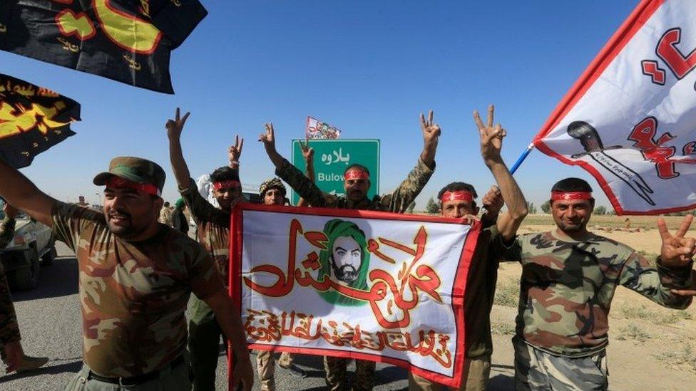 Shia Popular Mobilisation Forces (PMF) celebrate on the outskirts of Kirkuk (17 October 2017)