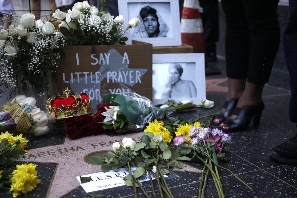 Flowers and tributes are placed on the Star for Aretha Franklin on the Hollywood Walk of Fame in Hollywood, California, August 16, 2018