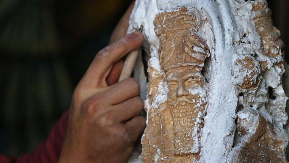 Ninos Thabit, an 18-year-old displaced Iraqi Christian who fled his hometown near Mosul due to the fighting between Iraqi forces and so-called Islamic State, recreating a historical Assyrian sculpture, one of the many destroyed by IS fighters in the ruins of Nineveh, 22 February 2017