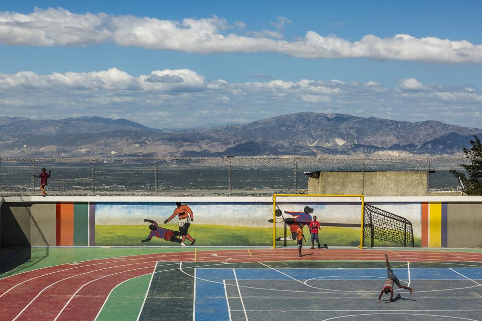 Children play at Jalousie's main sports arena