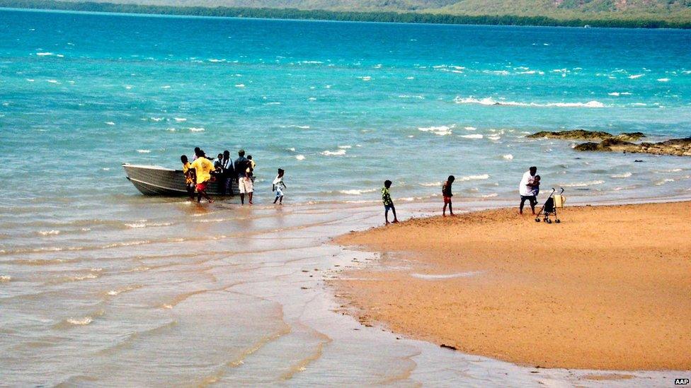 A family disembarks from their boat at Thursday Island in the Torres Strait, Australia