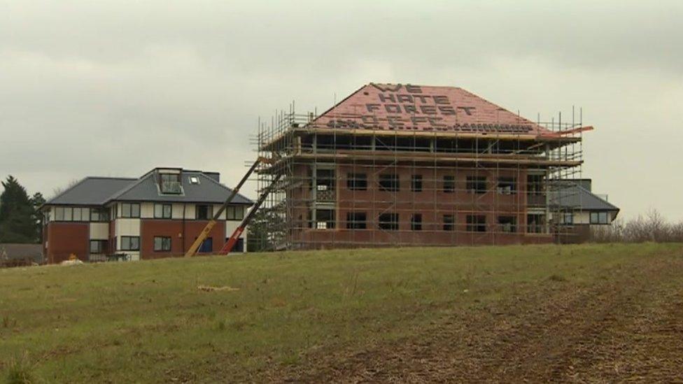 "We hate Forest" on roof of building on A50
