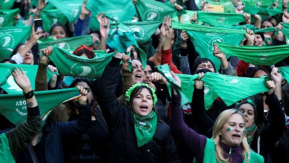 Activists hold green handkerchiefs, which symbolise the abortion rights movement, during a rally to legalise abortion, outside the National Congress in Buenos Aires, Argentina May 28, 2019