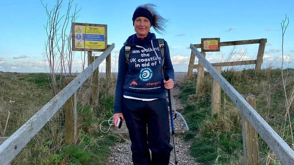 Blue Wilson walking near a beach