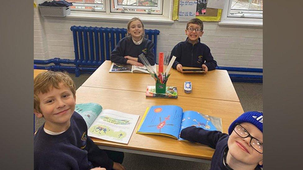 Children by an open window at Egremont Primary School