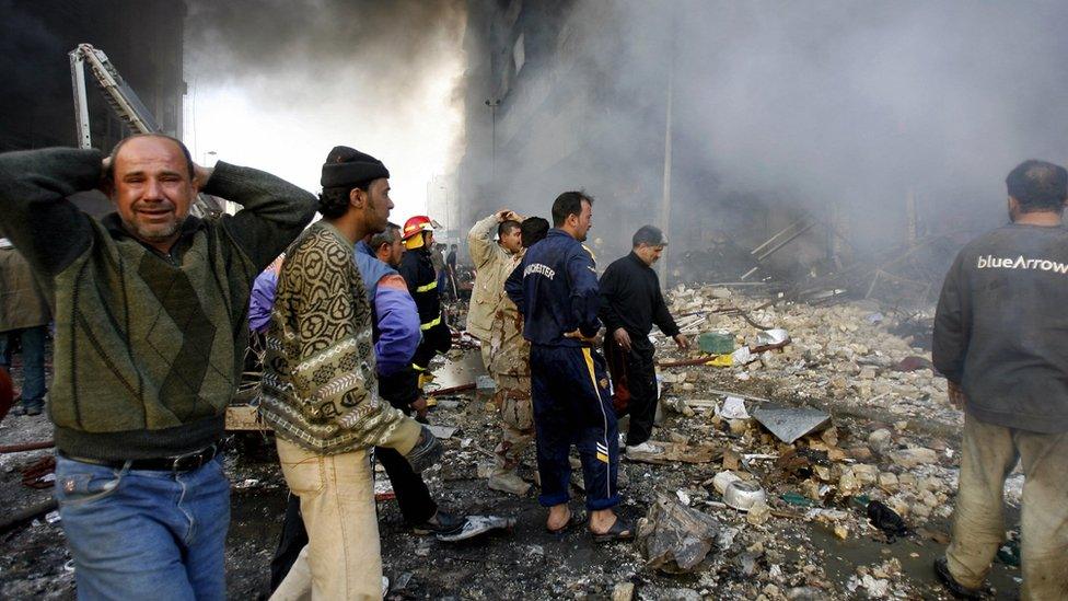 An Iraqi man reacts after a car bomb attack in central Baghdad on 13 February 2017