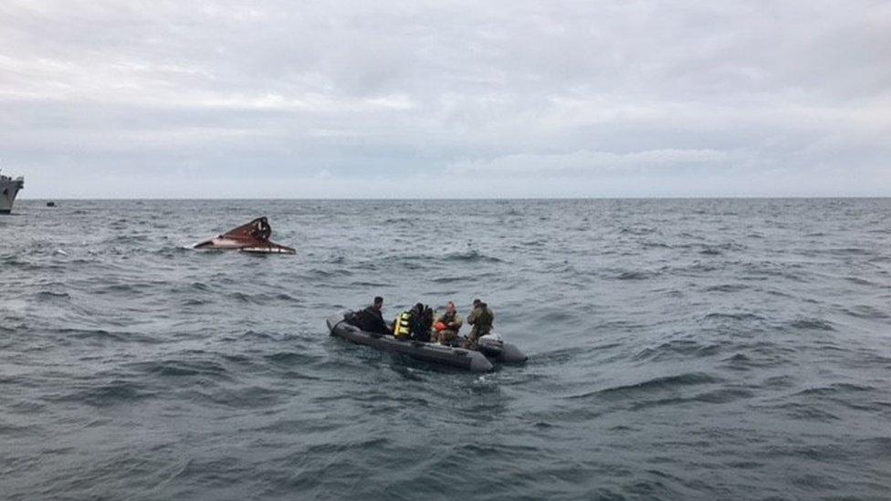 upturned hull in the sea