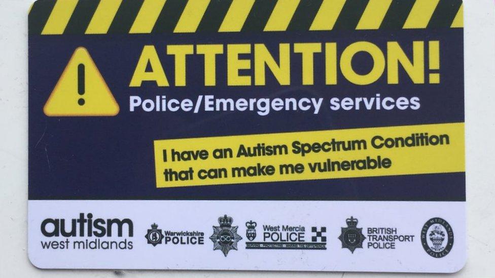 A card which reads: 'Attention! Police/Emergency. I have an Autism Spectrum Condition that can make me vulnerable'