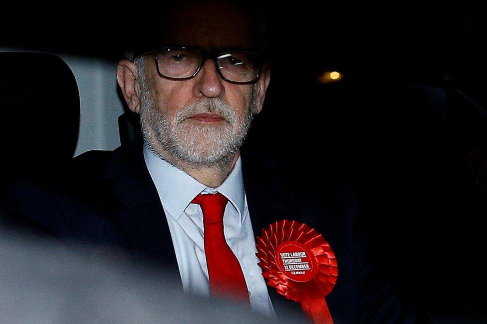 UK opposition leader Jeremy Corbyn leaves the Labour Party's headquarters following the general election in London