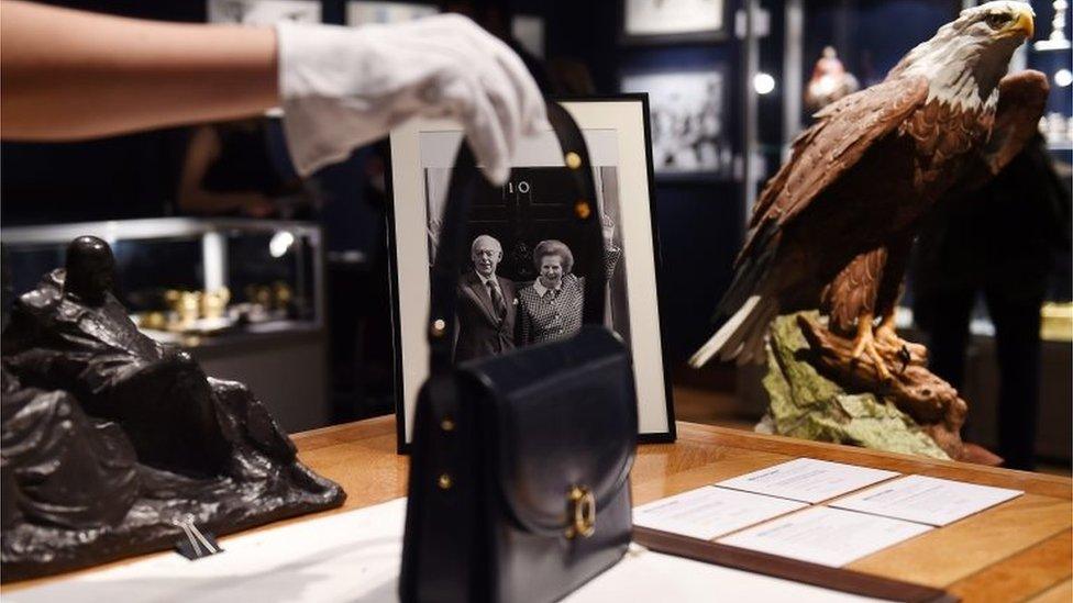 A handbag sits on the desk of Margaret Thatcher while on display during the sale of Margaret Thatcher"s collection