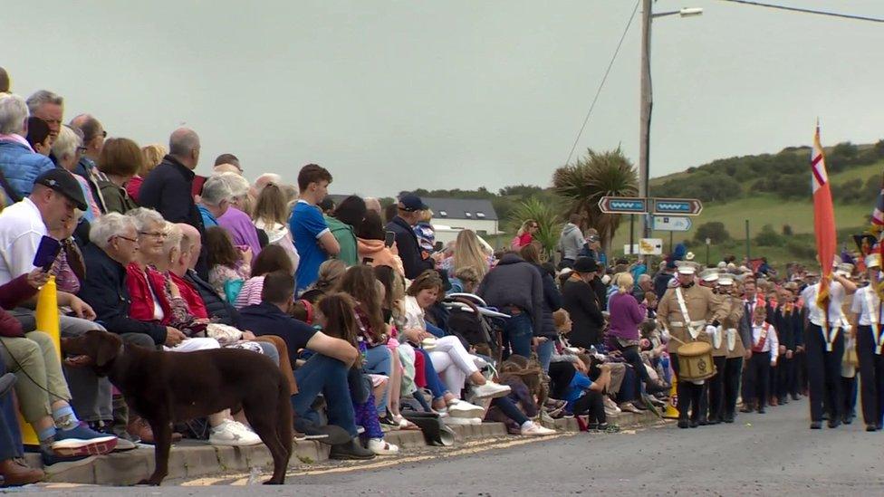 Spectators line the country roads