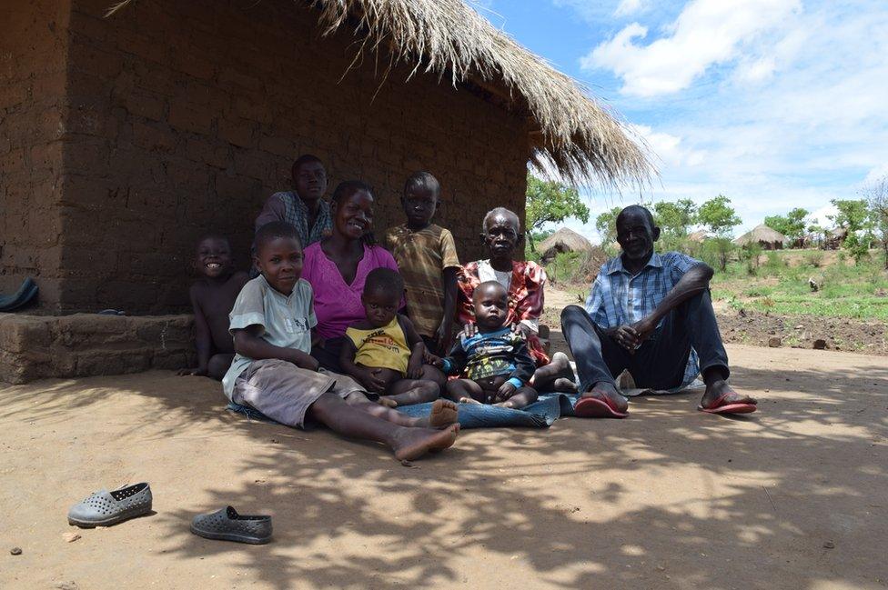 A family sits outside