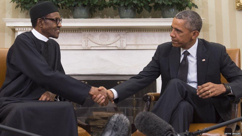 US President Barack Obama shakes hands with Nigerian President Muhammadu Buhari during a meeting in the Oval Office of the White House in Washington, DC, July 20, 2015.