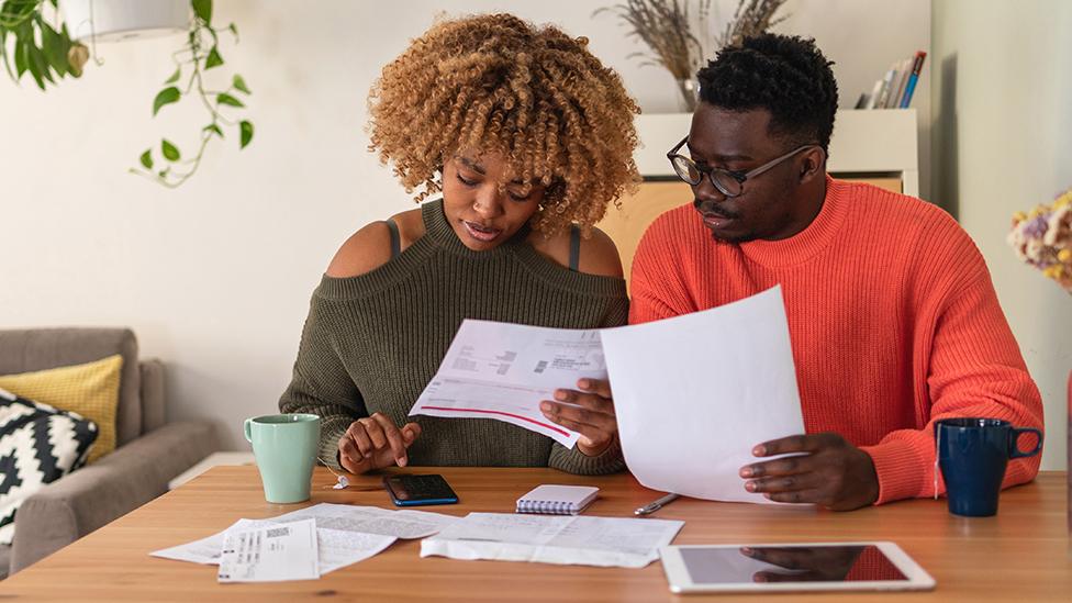 Couple looking at bills