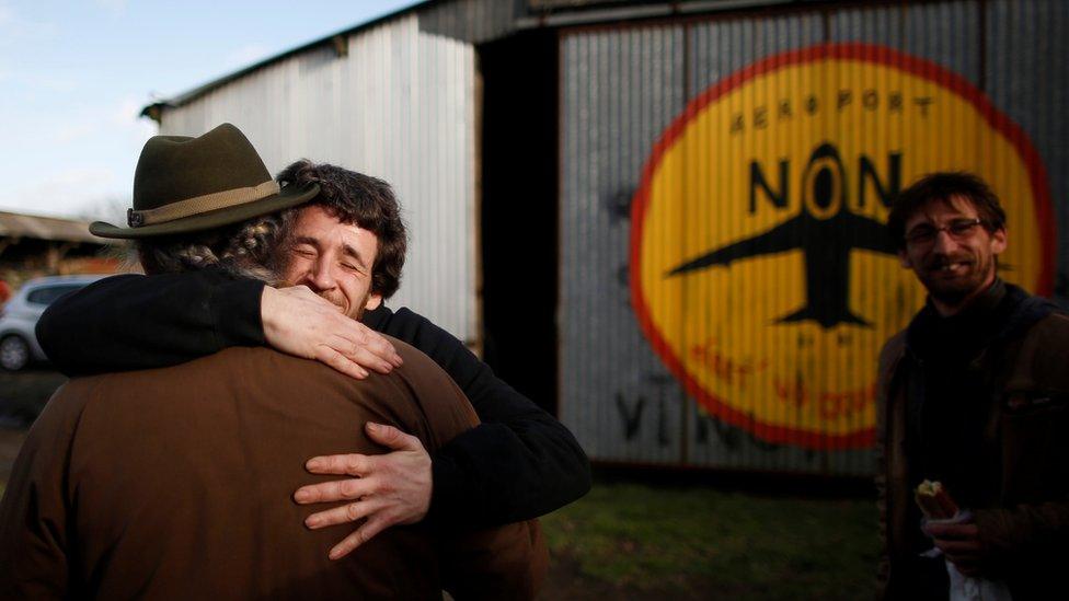 Protesters react after the French government's official announcement to abandon the Grand Ouest Airport (AGO) project in Notre-Dame-des-Landes, near Nantes, France, January 17, 2018.