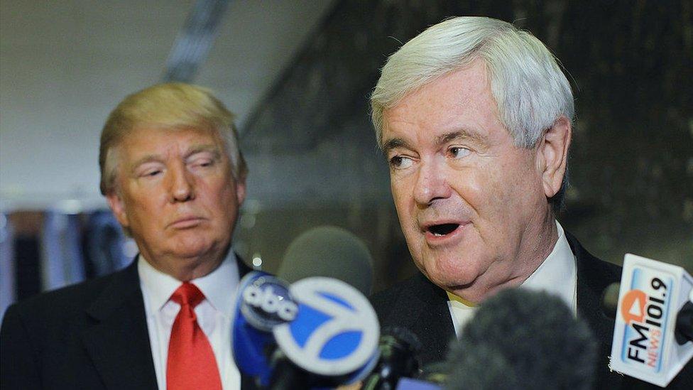 Newt Gingrich (R) speaks to the media as Donald Trump listens at Trump Tower