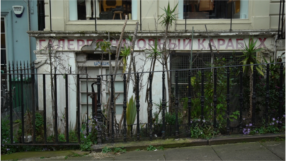 The Armenian rug store was crumbling, but had plants seemingly cared for by… someone…