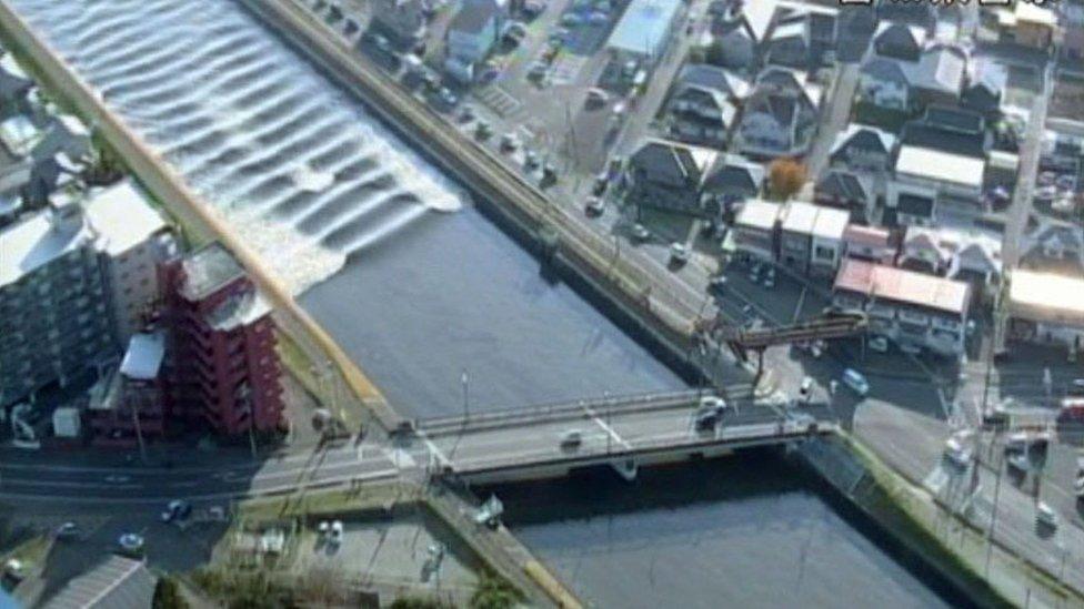 A tidal surge is seen in Sunaoshi River after tsunami advisories were issued following an earthquake in Tagajo, Miyagi prefecture, Japan November 22, 2016, in this video grab image released by Miyagi Prefectural Police via Kyodo