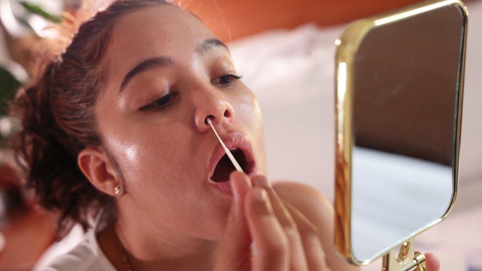 Girl doing a covid test at home