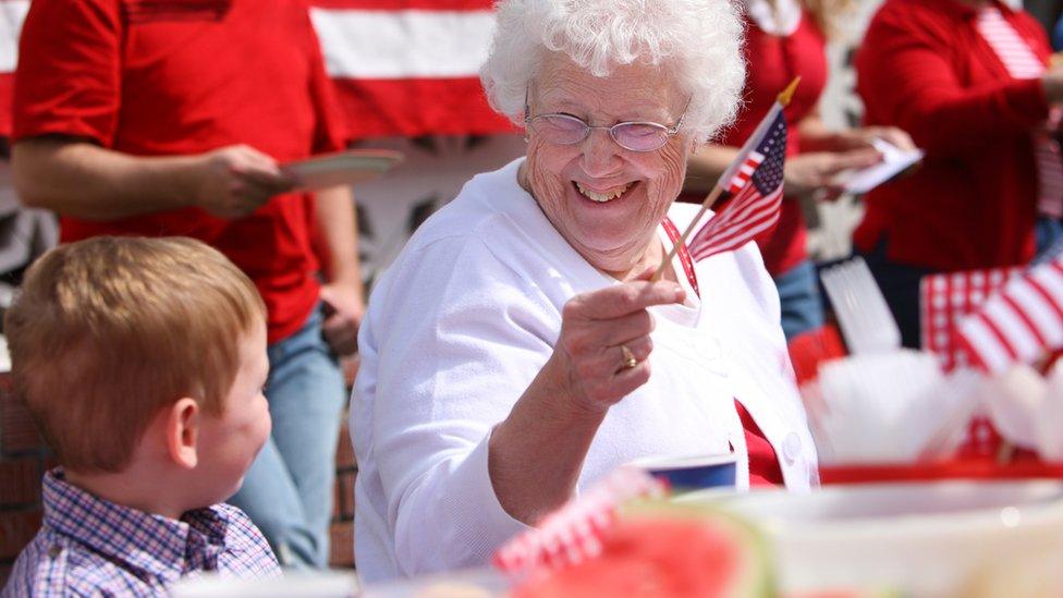 Grandmother and grandson celebrating Independence Day