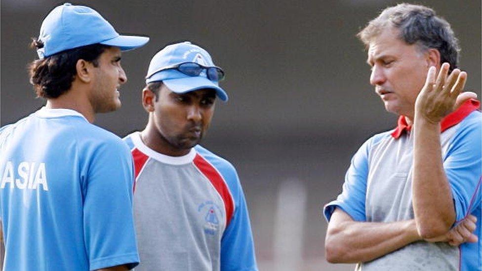 Asian XI cricketers Sourav Ganguly (L) and Mahela Jayawardane (C) listen to coach Roger Binny during a training session at the M. A. Chidambaram stadium in Chennai, 08 June 2007, on the eve of the second One Day International (ODI) match of the Afro-Asia cup between Asia XI and Africa XI