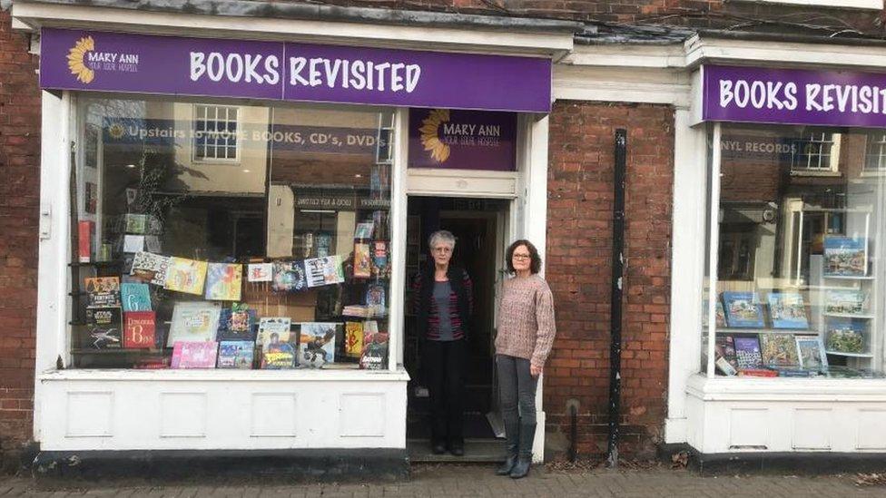 Volunteers in front of the Books Revisited charity shop