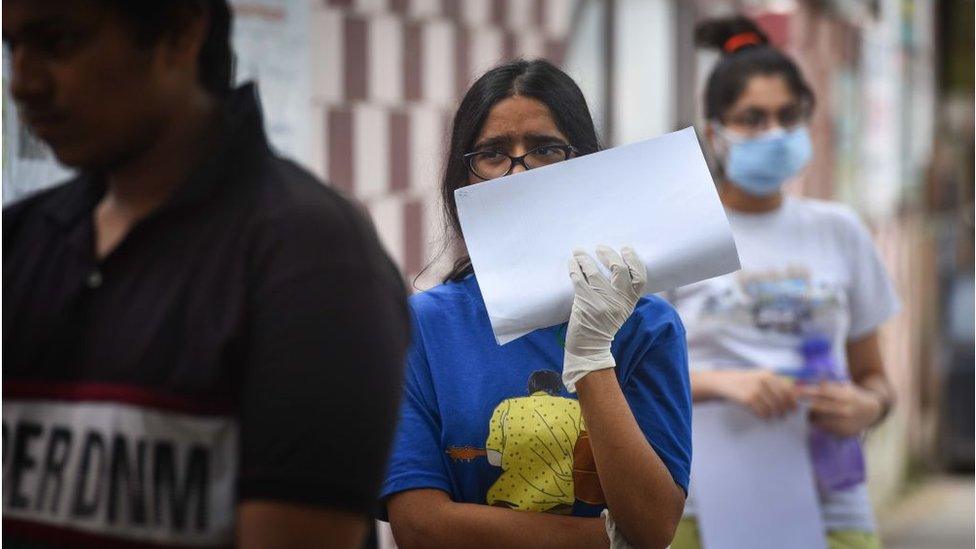 JEE aspirants queue to enter the examination centre in Delhi, India.