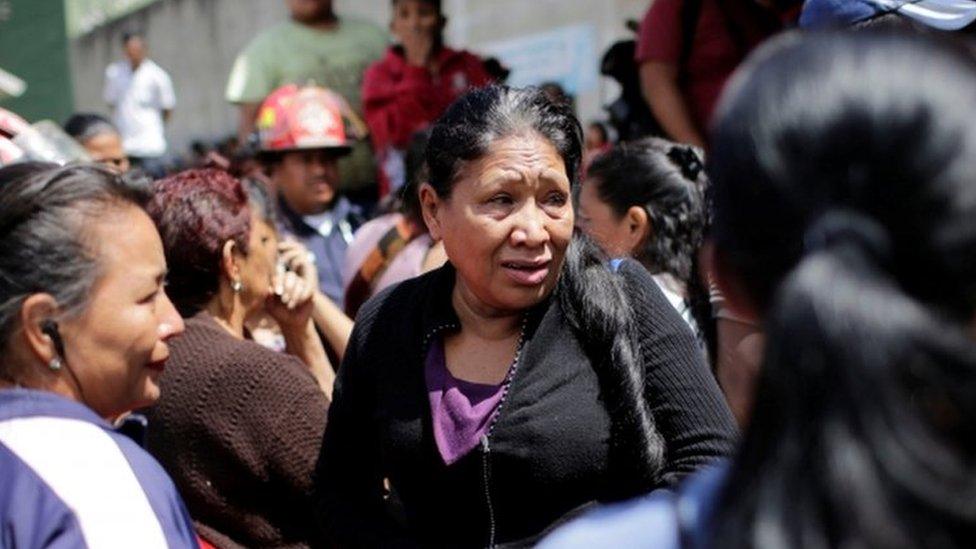 Anxious relatives gathered outside the shelter