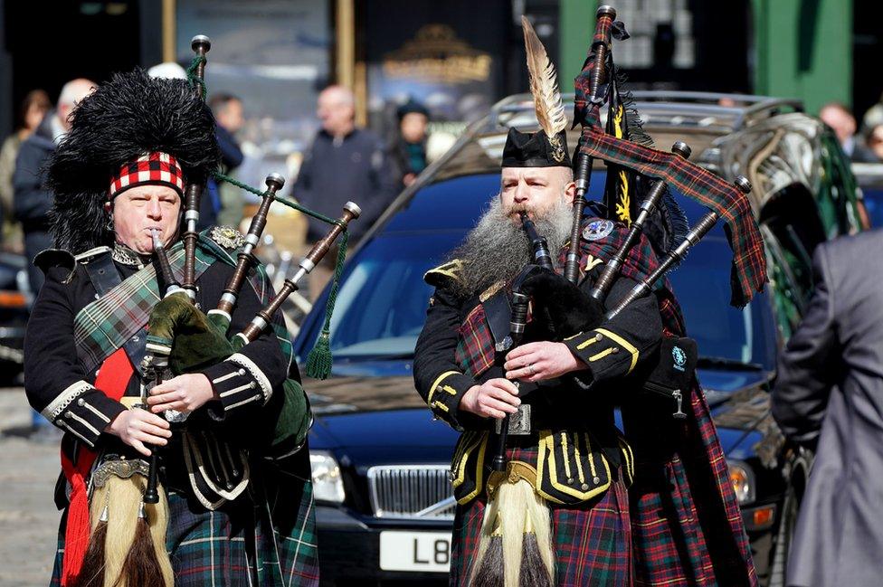 Pipers lead the funeral cortege on its way to St Giles Cathedral