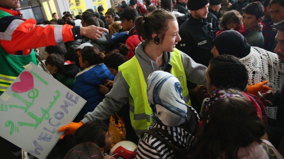 Migrants arriving from Hungary crowd into a holding space at Munich main railway station, 6 September