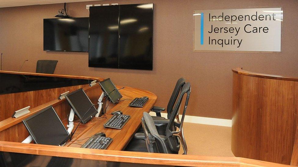 Computers, desks and screens inside the care inquiry panel room