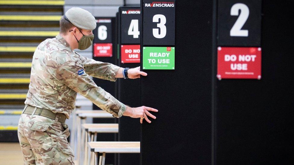 Members of the Royal Scots Dragoon Guard help set up a vaccination centre at the Ravenscraig Regional Sports Facility