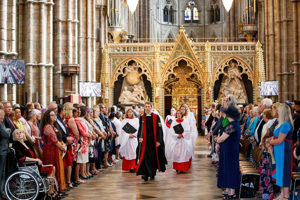 eople gather to attend a service to celebrate the 70th anniversary of the NHS at Westminster Abbey in London