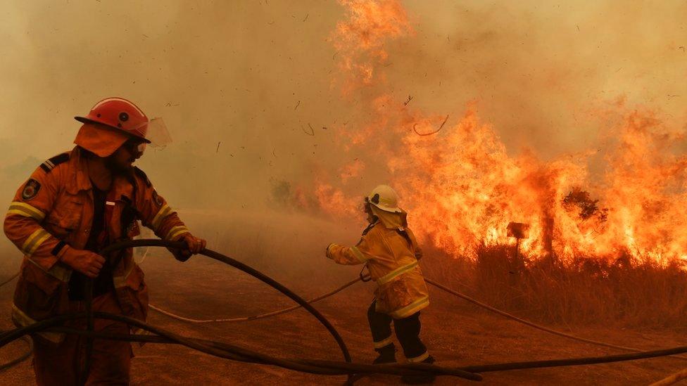 Australian firefighters battle a wildfire at close range earlier this month