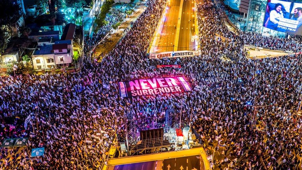 An aerial view shows people protesting at the Israeli's government's judicial overhaul in Tel Aviv, Israel (18 March 2023)