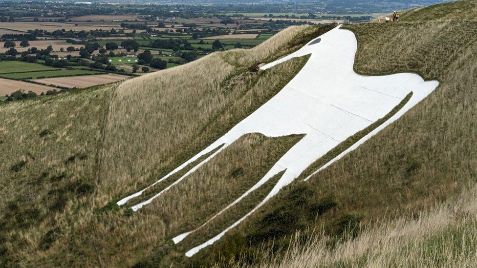 A horse monument on a hill