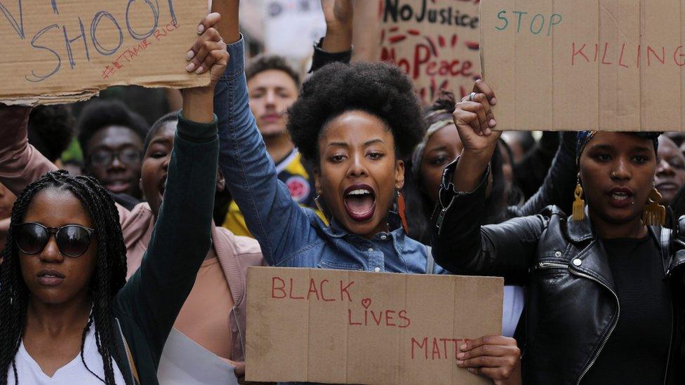 Demonstrators from the Black Lives Matter movement march through central London on July 10, 2016