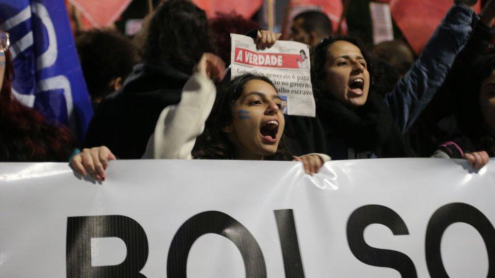 People stage a demonstration against Brazilian President Jair Bolsonaro