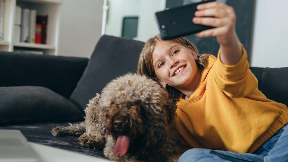 A girl takes a selfie