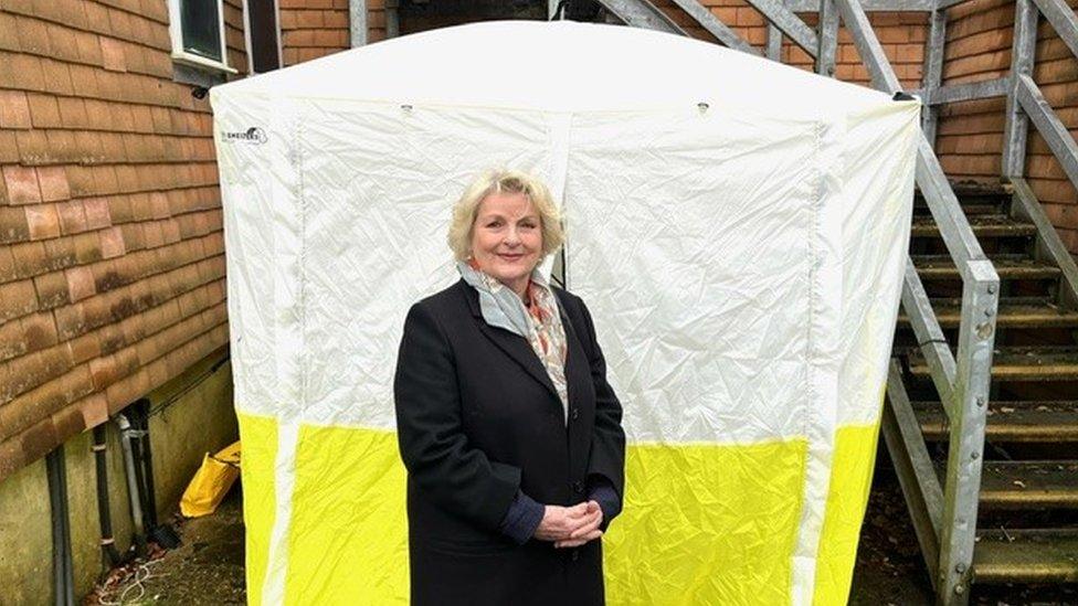 Brenda Blethyn standing outside a forensics tent