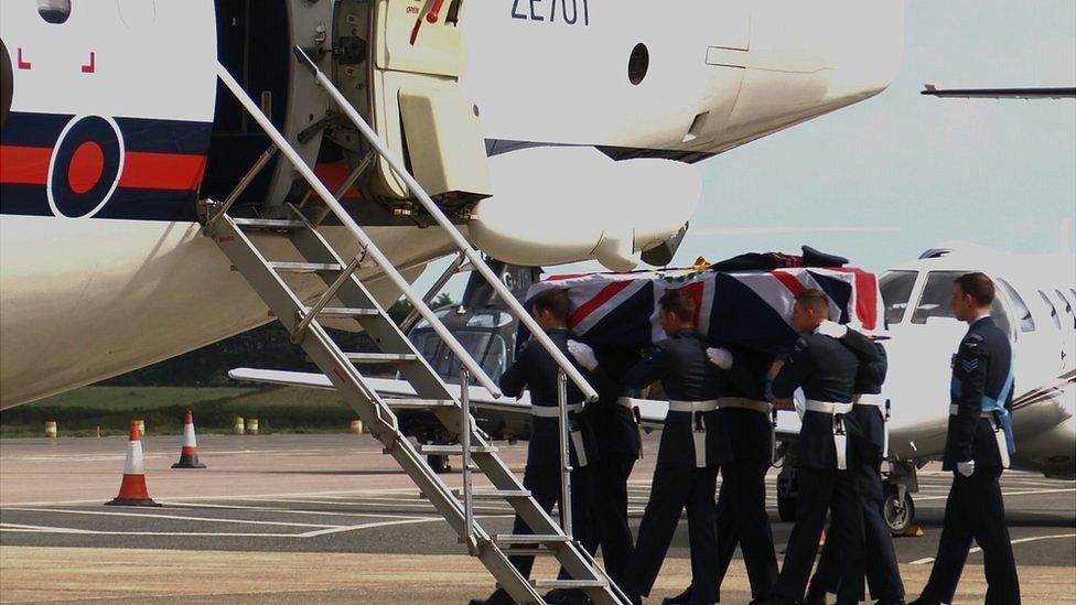 Coffin of Lieutenant Governor AM Peter Walker escorted to a RAF plane