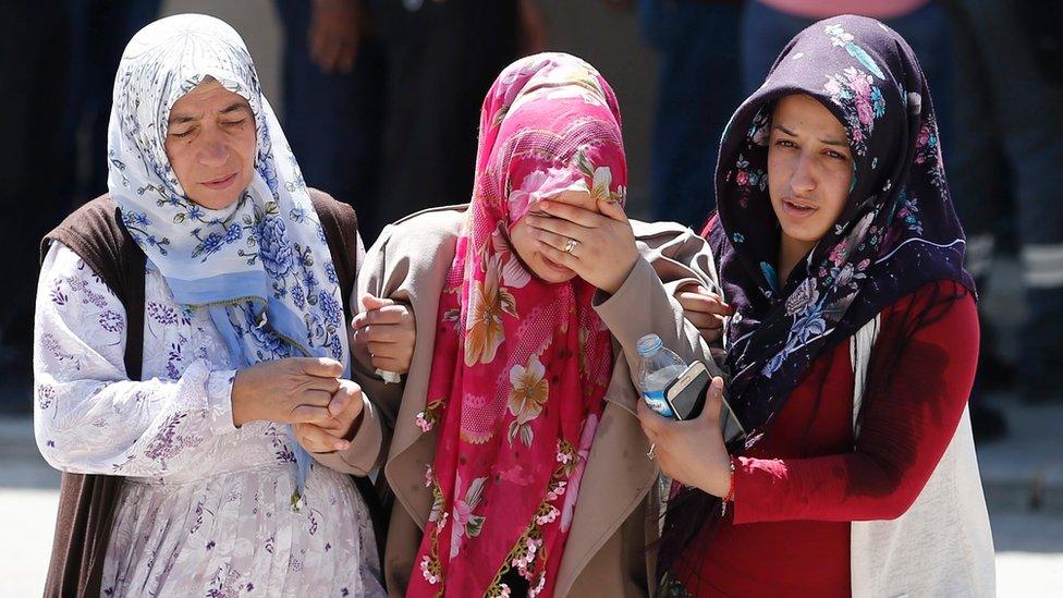 Relatives of Ahmet Toraman, who was killed in a bomb attack on late 20 August, mourn