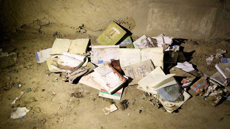 Bloodstained books and notebooks of students are seen on the ground at the scene of a suicide attack that targeted an educational center "Kohsar Danesh" in Kabul, Afghanistan, 24 October 2020.