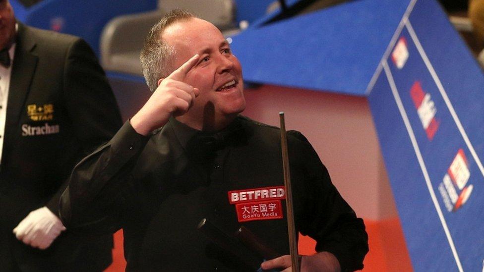 John Higgins celebrates his victory over Ryan Day