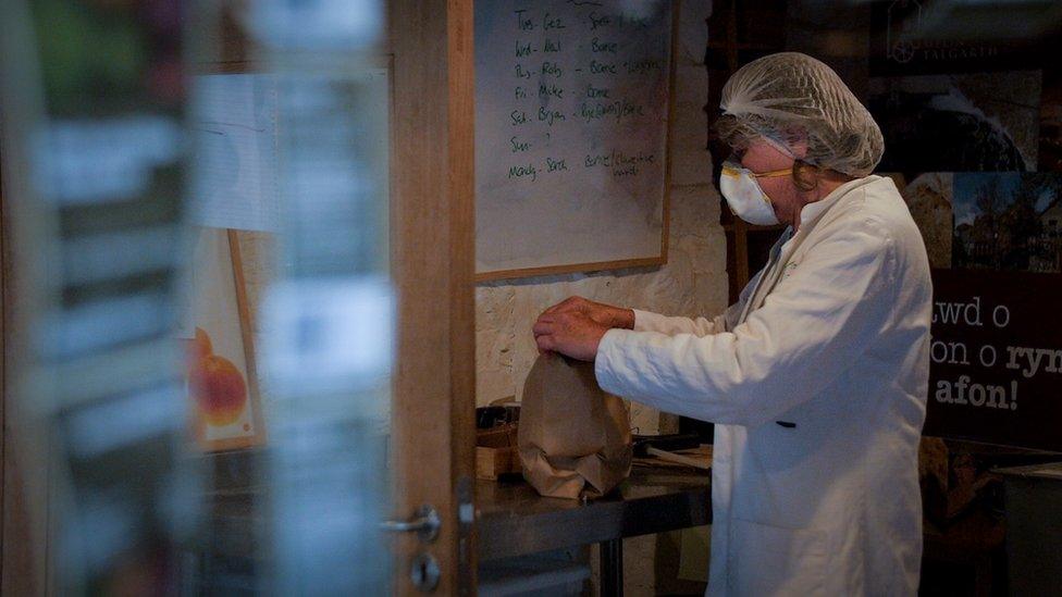 A miller bagging flour