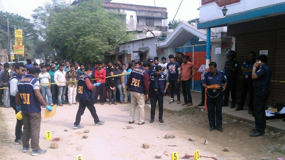 Bangladeshi police officials investigate the scene where an Italian priest was shot in Dinajpur, some 350 kilometres (220 miles) north of Dhaka, on November 18, 2015.